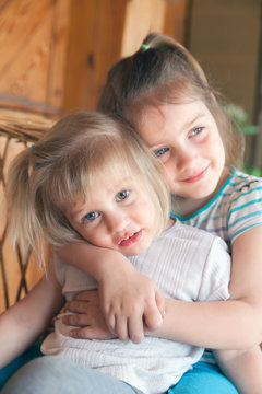 little sisters hugging