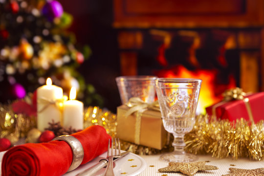 Christmas table with a fireplace and Christmas tree