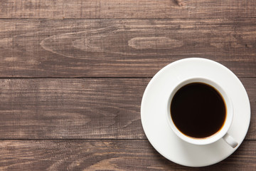 Coffee cup on wooden background. Top view