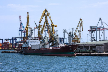 Fototapeta premium Cargo vessel in sea port, Odessa, Ukraine