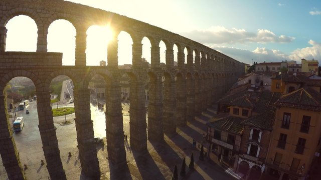 Aerial footage Segovia, Spain town skyline at the ancient Roman aqueduct. rotation zenith wide angle view aerial