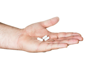 white pills in hand