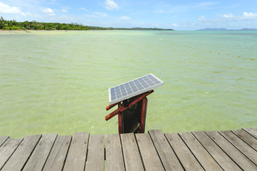 Fototapeta na wymiar Solar cell on Wooden pier on summer season - Wooden pier in Kho
