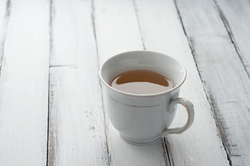 a cup of green tea on table