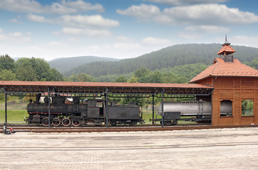 old steam locomotive on railway station