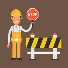 Builder holding stop sign and smiling