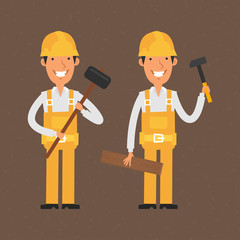 Two builders holding hammer and smiling