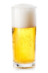 lush white foam in a glass of beer