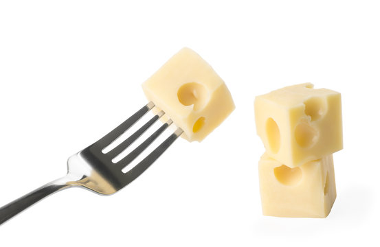 a piece of cheese on an iron fork