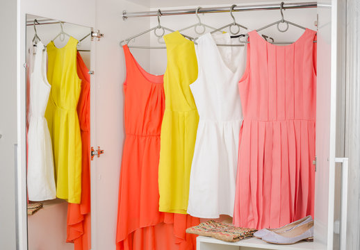  bright colorful dress hanging on coat hanger