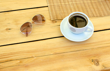 cup of coffee, glasses, water on table, relax time with empty space on table