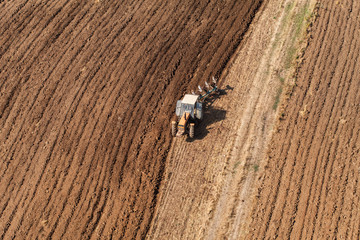 aerial view of harvest fields with tractor
