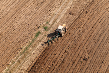 aerial view of harvest fields with tractor
