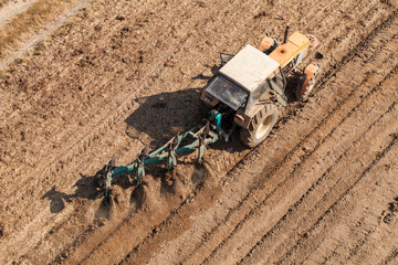 aerial view of harvest fields with tractor
