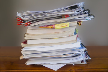 Pile of Study Books on Wooden Desk
