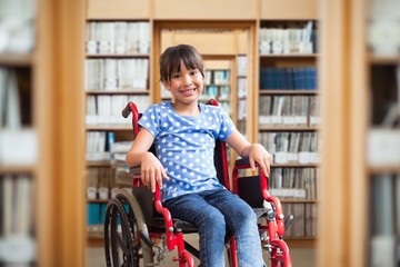 Cute disabled pupil smiling at camera 