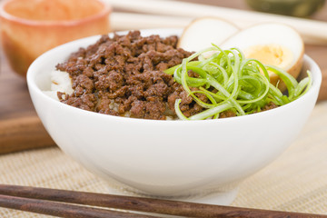 Lu Rou Fan (Taiwanese Braised Pork Rice Bowl) - Ground pork marinated and boiled in soy sauce served on top of steamed rice.
