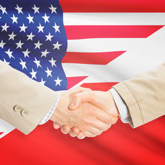 Businessmen handshake - United States and Poland