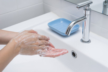 Washing of hands with soap under running water 1