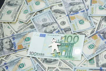 notes of dollars and euro and little man