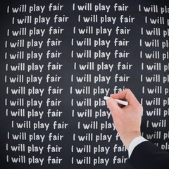 Hand of businessman writing with a white chalk