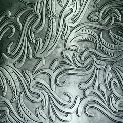 steel metal plate background with floral pattern