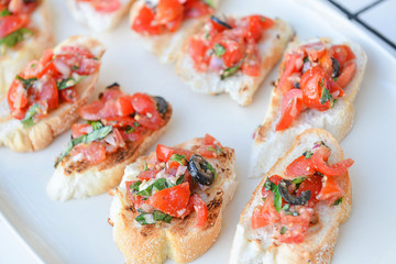 Italian Appetizer Bruschetta with Tomatoes, Cheese and Basi