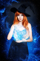 Beautiful young woman as halloween witch