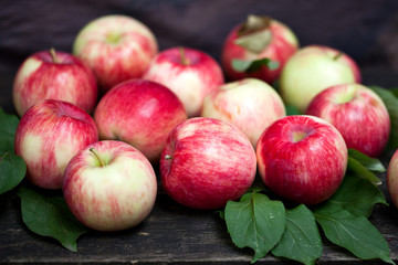 Red apples on rustic wood 