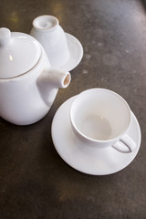 White ceramic tea pot ,cups and saucers