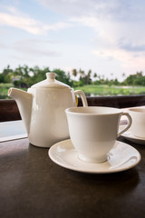 White ceramic tea pot ,cups and saucers