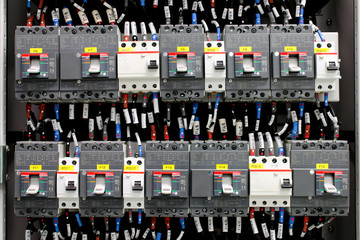 electricity distribution box with wires and circuit breakers