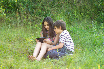 Children with a tablet