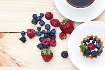 Tart  with Fresh berries - dessert on wooden table close up