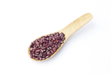 Red beans on wooden spoon isolated on white background