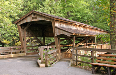 Covered Bridge – A wooden, old covered bridge in the country.