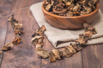 Dried mushrooms in wooden bowl