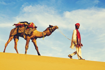 Indigenous Indian man walking desert camel Concept