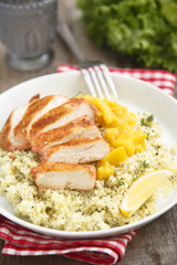 Grilled chicken with couscous and mango