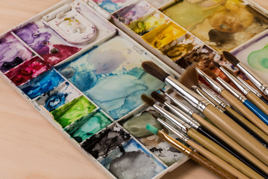 art palette with brushes and paints