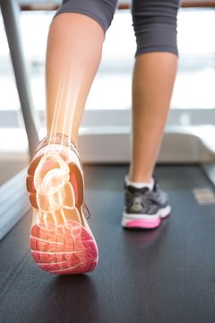 Highlighted ankle bone of woman on treadmill
