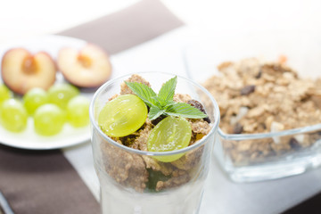 cereals with fruit, mint, on a table