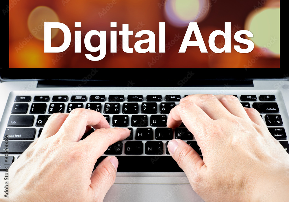 Poster digital ads word on laptop screen with hand type on keyboard, di