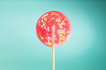 Photo sur Aluminium Bonbons Giant lollipop on blue background