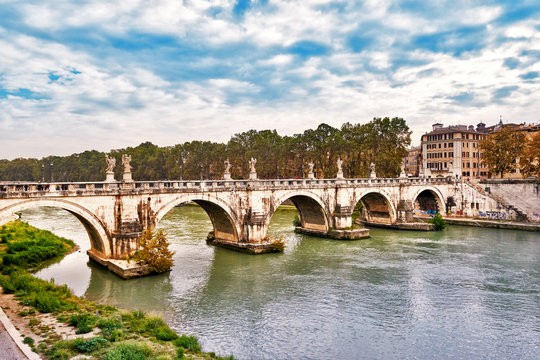 Fototapeta Bridge Ponte Sant Angelo in Rome across river Tiber in Rome
