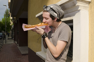 Student eating fast food in the break