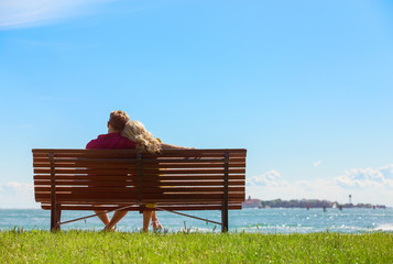 Couple sitting on park bench