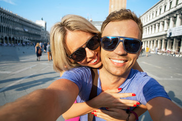 Naklejka premium Smiling couple making selfie photo