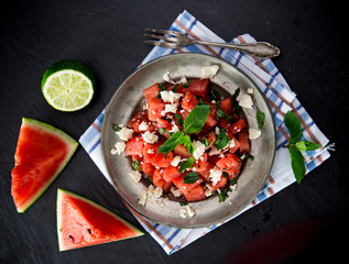 Fresh salad with water-melon, feta cheese, lime and mint.