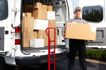 Young delivery man with parcel.